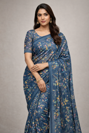 chitra fashions Woman wearing a blue floral saree on a gray background