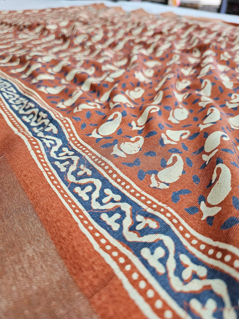 542005 Semi Silk Batik Print Saree With Zari Weaving Border - Rusty